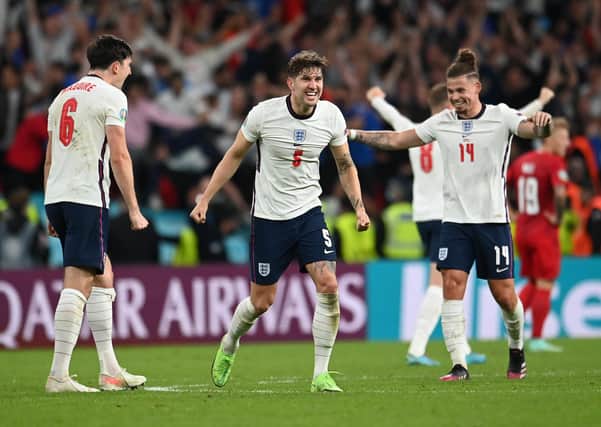 Harry Maguire, John Stones, and Kalvin Phillips of England celebrate following their team's victory in the UEFA Euro 2020 Championship Semi-final match between England and Denmark at Wembley Stadium (Picture: Andy Rain - Pool/Getty Images)