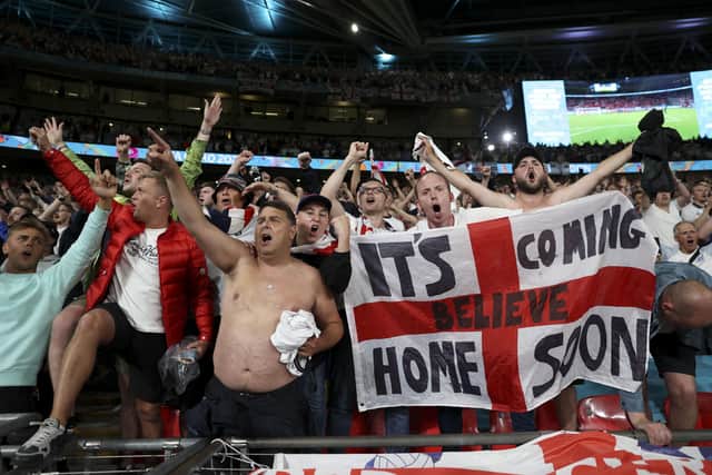England fans cheer on the team at Wembley