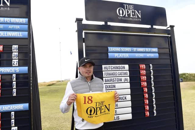 JOB DONE: Leeds' Ben Hutchinson poses with The Open flag after qualifying for the 149th Open Championship at St Annes Old Links Golf Club. Picture: Richard Martin-Roberts/Getty Images.