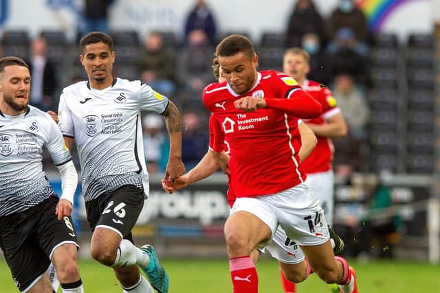Barnsley's Carlton Morris on the attack as Swansea's Matt Grimes closes in. Picture: Bruce Rollinson.