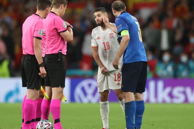 Mind games: Giorgio Chiellini of Italy, right, prior to the semi-final penalty shootout playfully pulls the cheek of opposite number Jordi Alba of Spain. Was the shootout won there and then? (Picture: Carl Recine/Getty Images)