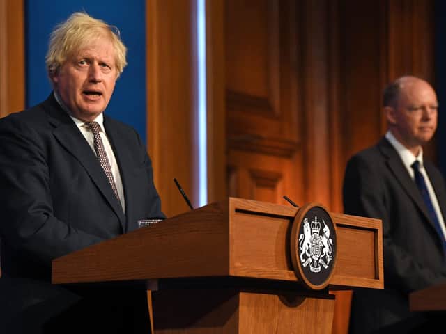 Prime Minister Boris Johnson and Chief Medical Officer Professor Chris Whitty during a media briefing in Downing Street, London, on coronavirus. Picture: Daniel Leal-Olivas/PA Wire