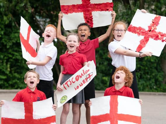 Pupils of Whingate Primary School, Leeds, support their former alumni England and Leeds midfielder Kalvin Phillips