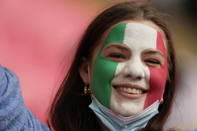 An Italian fan enjoys prior to the start of the the Euro 2020 soccer championship round of 16 match between Italy and Austria at Wembley stadium in London, Saturday, June 26, 2021. (AP Photo/Frank Augstein, Pool)