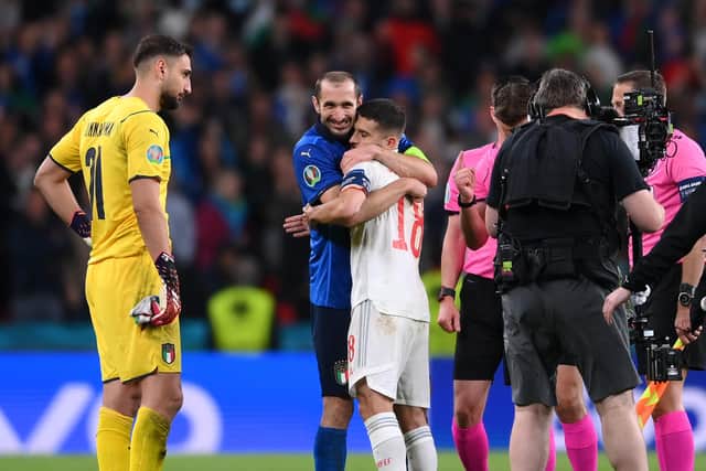 Give us a love: Giorgio Chiellini of Italy interacts with Jordi Alba of Spain during the penalty shoot out coin toss during the UEFA Euro 2020 Championship Semi-final match between Italy and Spain at Wembley Stadium on July 06, 2021 in London, England. (Picture: Laurence Griffiths/Getty Images)