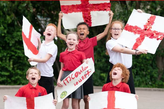Pupils of Whingate Primary School, Leeds, support their former alumni England and Leeds midfielder Kalvin Phillips, ahead of the UEFA Euro 2020 Final on Sunday. Image: Danny Lawson