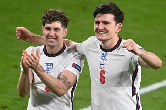 Harry Maguire and John Stones of England celebrate victory. (Picture: Michael Regan - UEFA/UEFA via Getty Images)
