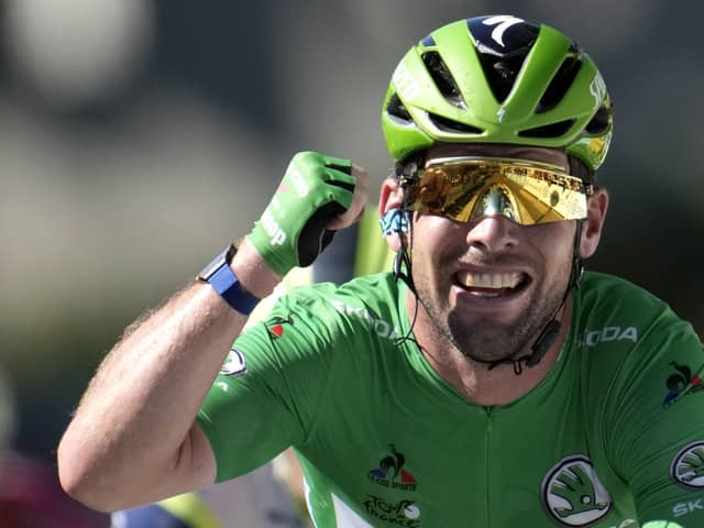 Record equaller: Mark Cavendish celebrates winning his 34th stage of the Tour de France to pull alongside Eddy Merckx. Picture: Christophe Ena/AP