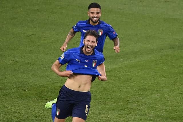 Italy's Manuel Locatelli celebrates with his team-mate Lorenzo Insigne after scoring his side's first goal during the Euro 2020 soccer championship group A match between Italy and Switzerland at the Rome Olympic stadium, Wednesday, June 16, 2021. (AP Photo/Riccardo Antimiani, Pool)