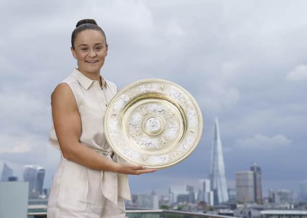 Ash Barty: Poses with the Wimbledon trophy after winning the ladies singles title.