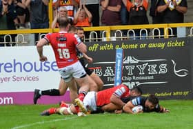 Well beaten: Castleford’s Alex Foster scores his side’s third try against Salford yesterday. Picture: Jonathan Gawthorpe
