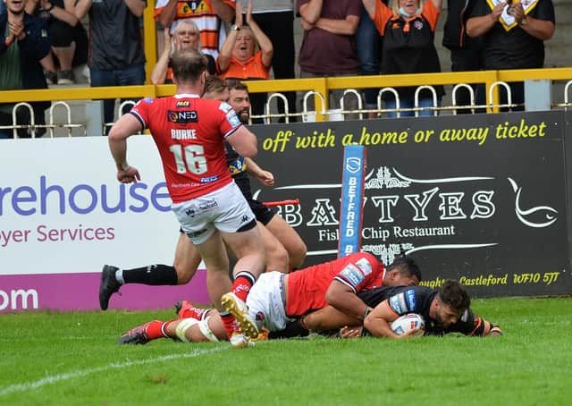 Well beaten: Castleford’s Alex Foster scores his side’s third try against Salford yesterday. Picture: Jonathan Gawthorpe