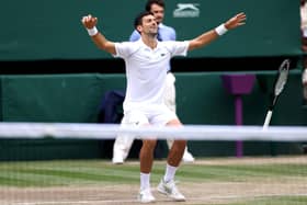Still unbeatable: Novak Djokovic sinks to the floor at the moment of his sixth Wimbledon men’s singles victory and 20th garnd slam title, despite being pushed hard over four sets by Italian Matteo Berrettini in his first grand slam final. (Picture: Steve Paston/PA)
