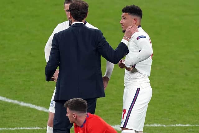 England manager Gareth Southgate consoles Jadon Sancho after his penalty miss (Picture: PA)