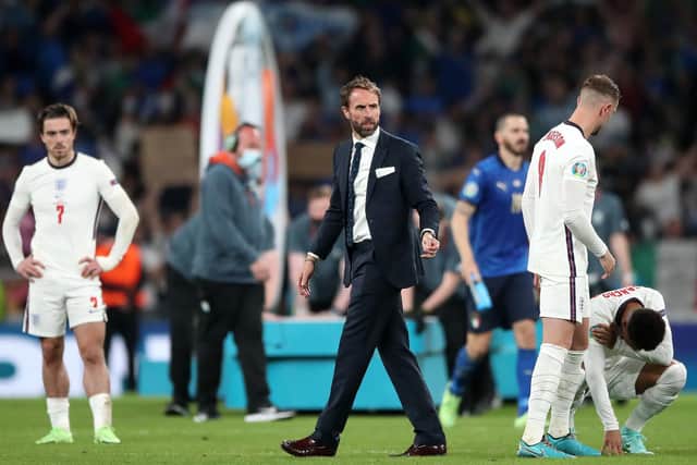 England manager Gareth Southgate with his players following defeat in the penalty shoot-out