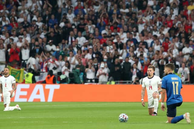 England's Kyle Walker (left) and Kalvin Phillips with Italy's Ciro Immobile takes the knee before the UEFA Euro 2020 Final at Wembley Stadium, London. Picture: Nick Potts/PA Wire