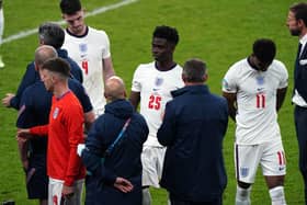 England manager Gareth Southgate stands dejected alongside Bukayo Saka and Marcus Rashford following the UEFA Euro 2020 Final at Wembley Stadium, London. (Picture: PA)