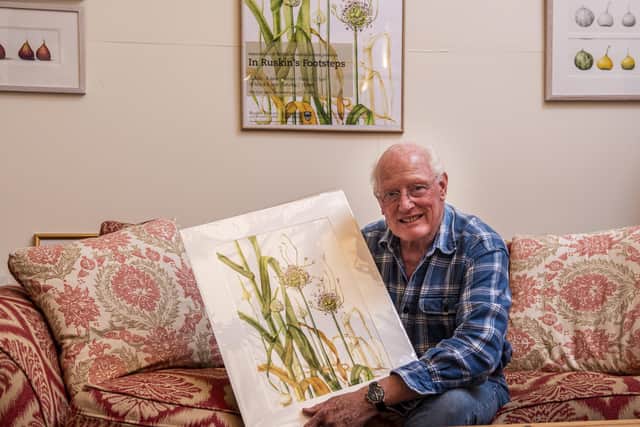 Charles Francis, husband of the late botanical illustrator Mally Francis, photographed with some of Mally's famous illustrations in their house and studio in Cornwall. Picture: Ernesto Rogata.