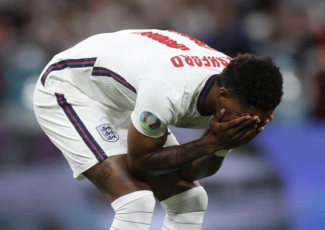 England's Marcus Rashford reacts after failing to score a penalty against Italy. (Carl Recine/Pool Photo via AP)