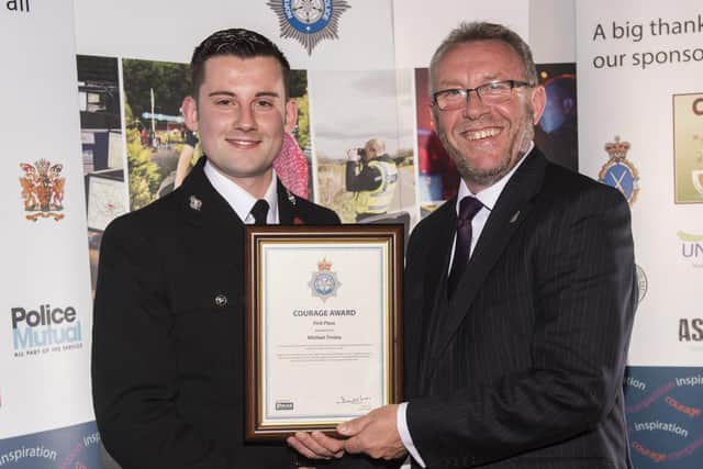 Sgt Michael Tinsley receiving his Gold Courage Award from Mike Stubbs of The Police Federation