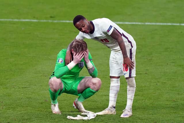 England goalkeeper Jordan Pickford stands dejected with  Raheem Sterling (right) following the UEFA Euro 2020 Final at Wembley Stadium, (Picture: PA)