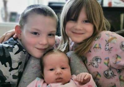 Hope with her brother and sister.The family are holdng a fund-rasier this weekend for the two charities that helped them through