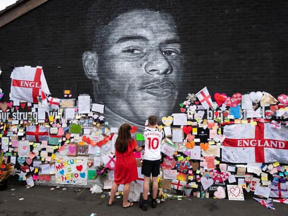 A mural of Manchester United striker and England player Marcus Rashford on the wall of the Coffee House Cafe on Copson Street, Withington. The mural appeared vandalised on Monday after the England football team lost the UEFA Euro 2021 final. (Danny Lawson/PA)