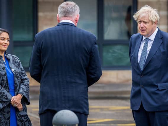 Boris Johnson and Priti Patel have given shifting statements on the England football team taking the knee. Picture: Charlotte Graham