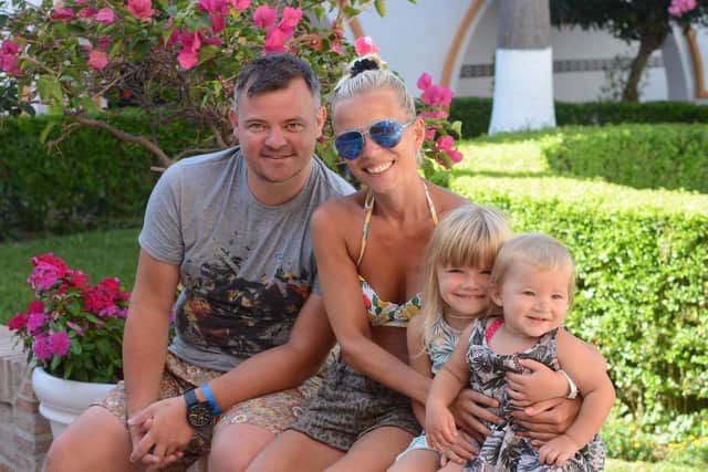 The family on holiday before husband John's sudden death