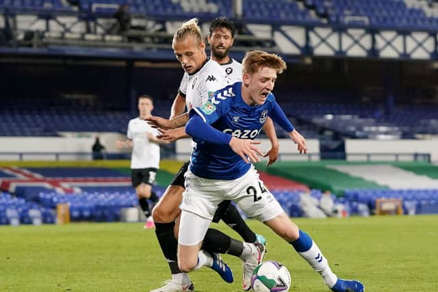 Oscar Threlkeld (left) battles with Everton's Anthony Gordon during a Carabao Cup second round match at Goodison Park for Salford City. Picture: Jon Super/NMC Pool/PA