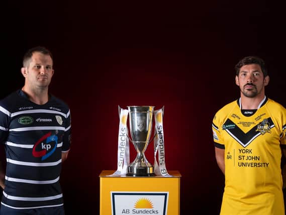 Featherstone Rovers captain James Lockwood, left, and York City Knights counterpart Chris Clarkson with the 1895 Cup. (ALLAN MCKENZIE/SWPIX)