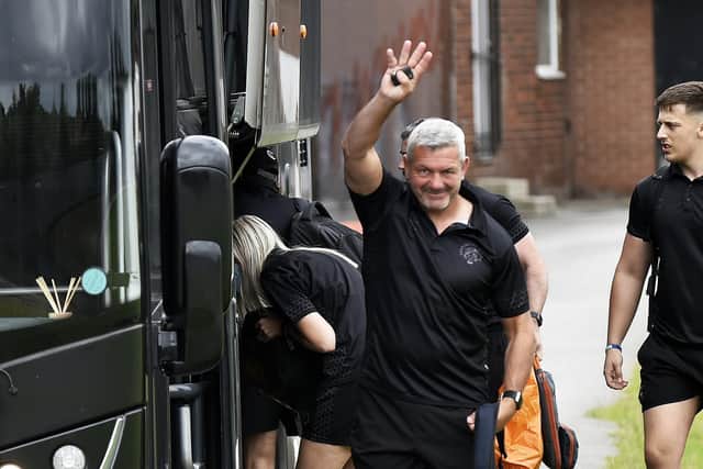 SEE YOU THERE: Daryl Powell waves to fans before he boards the coach taking his team to London for Saturday's Challenge Cup Final against St Helens. Picture: Steve Riding.