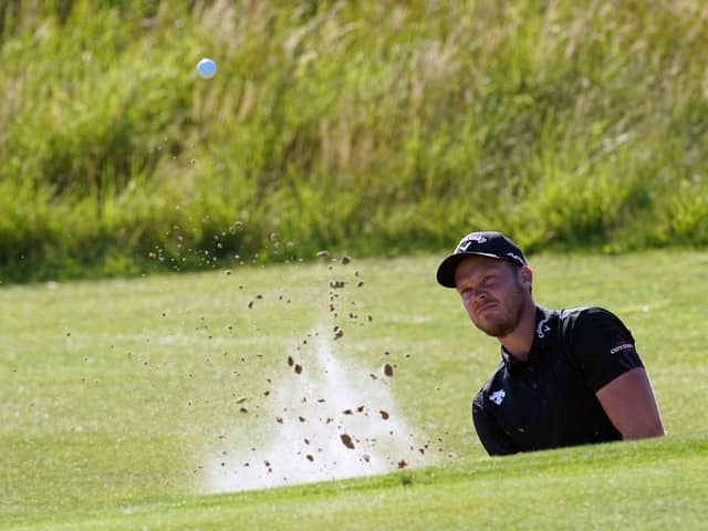 England's Danny Willett chips out of a bunker on the 6th. Picture: PA
