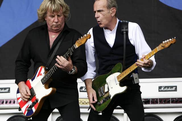 Rick Parfitt (left) and Francis Rossi of Status Quo performing at the Glastonbury Festival in 2009. (PA).