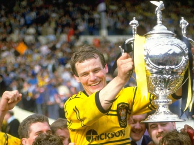 MAGIC MOMENT: Castleford's John Joyner holds the Challenge Cup trophy aloft after beating Hull KR in the final at Wembley Stadium in 1986. Picture: Bob  Martin/Allsport/Getty Images.