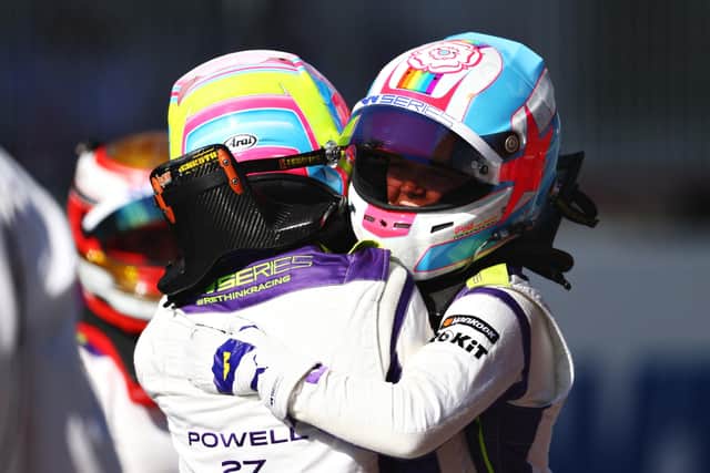 HISTORY MAKER: Sarah Moore, right, became the first openly gay LGBTQ+ driver to stand on a podium during a Grand Prix weekend last month as she targets more success as Silverstone today. Picture: Getty Images.