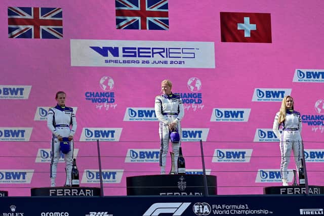 HISTORY MAKER: Sarah Moore, left, became the first openly gay LGBTQ+ driver to stand on a podium during a Grand Prix weekend last month as she targets more success as Silverstone today. Picture: Getty Images.