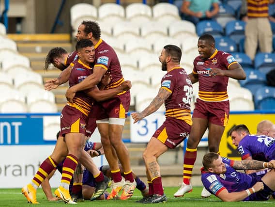 Huddersfield Giants' Will Pryce celebrates his try. (BRUCE ROLLINSON)