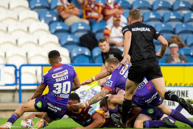 Huddersfield Giants' Will Pryce stretches overs to score but it would not be enough. (BRUCE ROLLINSON)