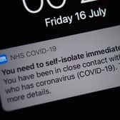 A notification issued by the NHS coronavirus contact tracing app - informing a person of the need to self-isolate immediately, due to having been in close contact with someone who has coronavirus (Yui Mok/PA)