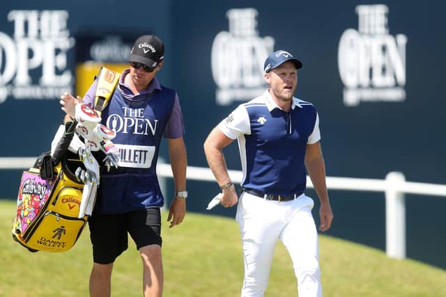 England's Danny Willett, right, and his caddie leave the first tee on his final round at The Open at Royal St George's. Picture: David Davies/PA