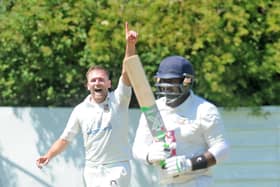 Gone: Carlton bowler Jonathan Rudge, who took six wickets, has Ossett's Sajith Wamakulasuriya caught by wicketkeeper Thomas Taylor for 0 in the Bradford League. Pictures: Steve Riding