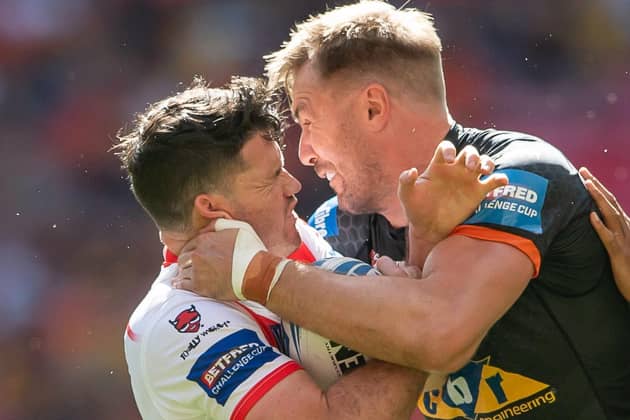 Castleford Tigers' Michael Shenton, right, gets to grips with St Helens' Lachlan Coote (ALLAN MCKENZIE/SWPIX)