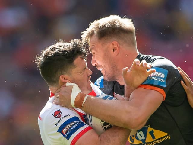Castleford Tigers' Michael Shenton, right, gets to grips with St Helens' Lachlan Coote (ALLAN MCKENZIE/SWPIX)