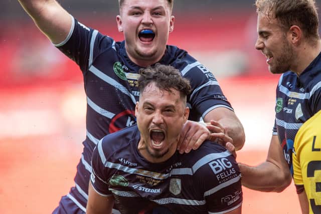 What is means: Jake Sweeting celebrates his opening try for Featherstone. Picture Bruce Rollinson