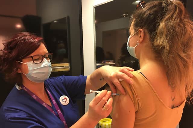 Handout photo issued by NHS England of Andrea Brighenti receiving a vaccination at a Covid-19 vaccination centre inside the Primark Bristol store.