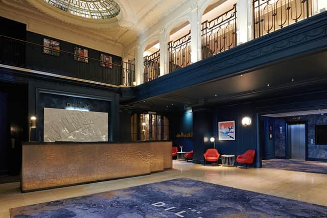 The Lobby at The Dilly ins in contract to its traditional façade with modern dark blue pain work