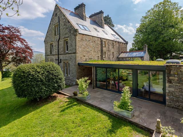 The former vicarage is now a B&B with contemporary owners annexe sporting a green roof and glazed front with views over Wensleydale