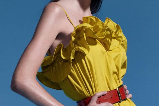 Yellow ruffled dress, £24.99, H&M and HM.com; red leather belt, £12; green mules, £29.99, Zara.