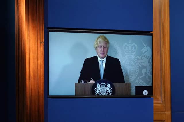 Boris Johnson appearing via video-link from Chequers where he is in self-isolation.